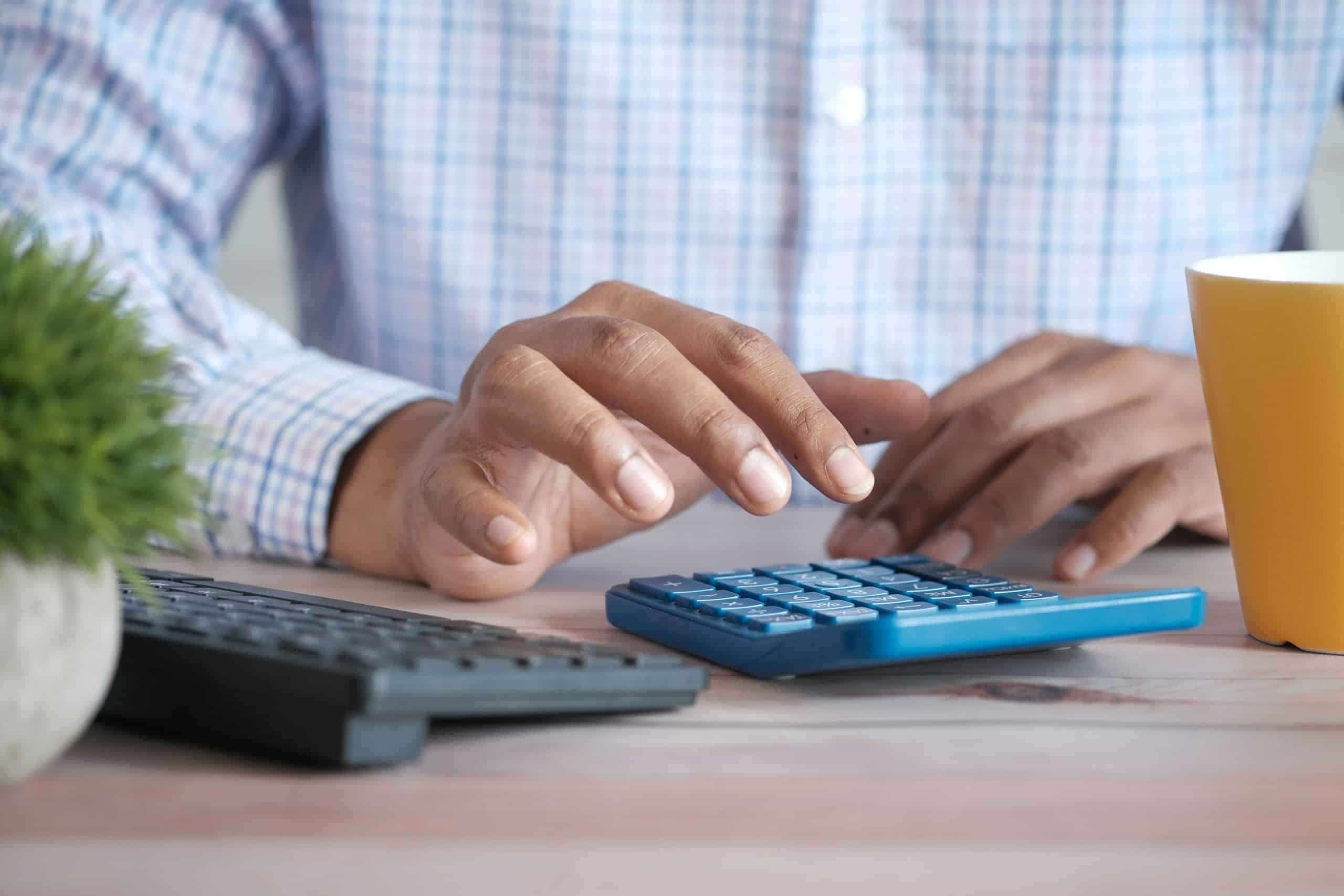 An accountant at Aimfin calculating provisional tax.