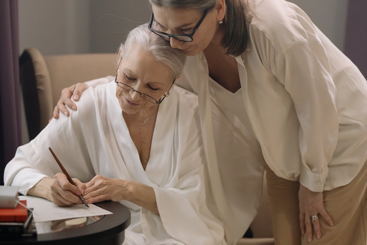 An elderly mother writing her will